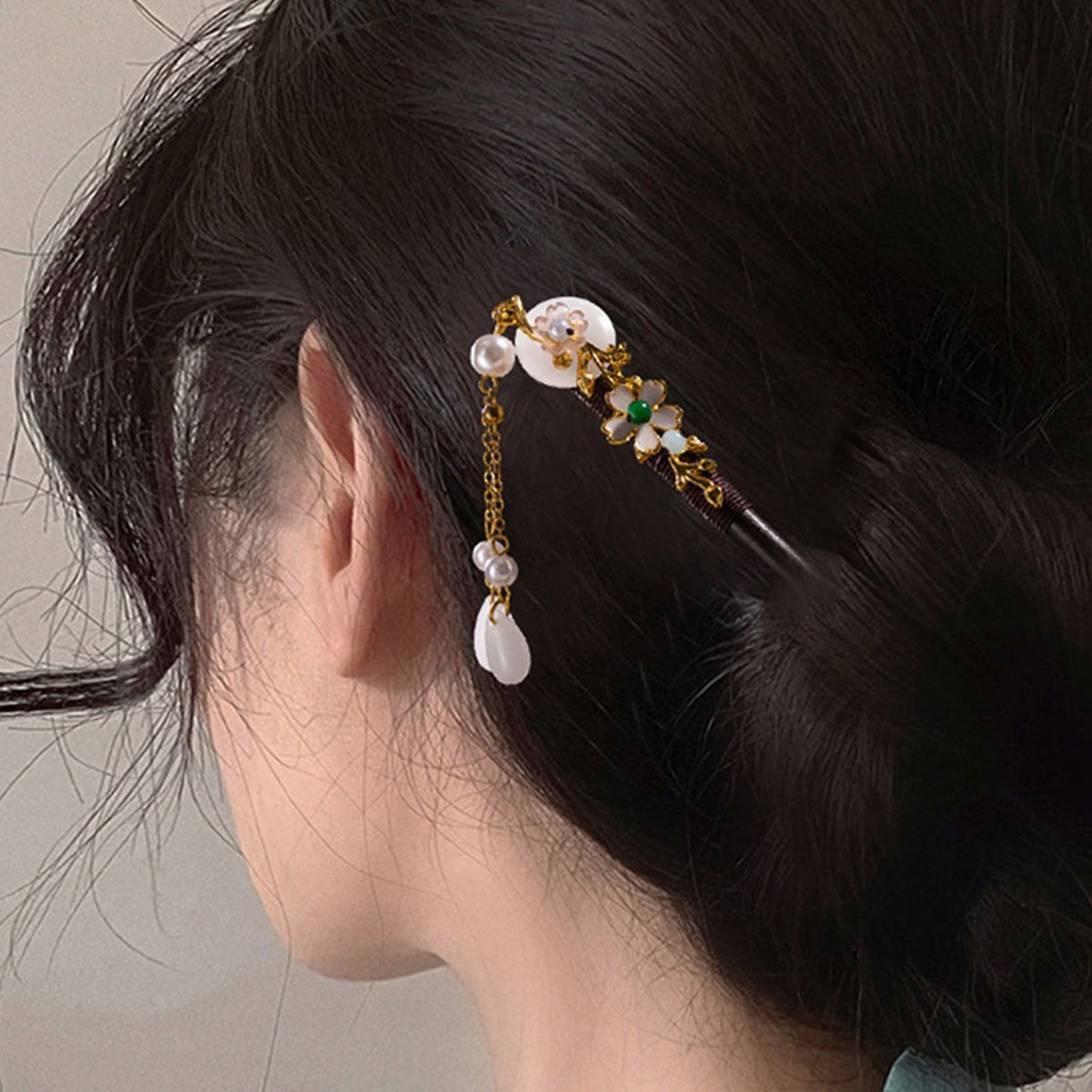 Elegant floral wedding hair accessory with beads and charms
