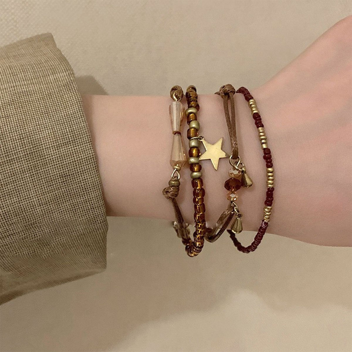 Elegant glass and crystal boho bracelet with earthy tones and charms