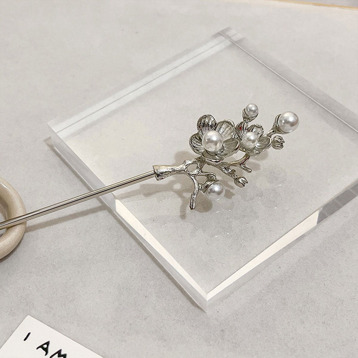 Elegant silver flower hair accessory with pearls