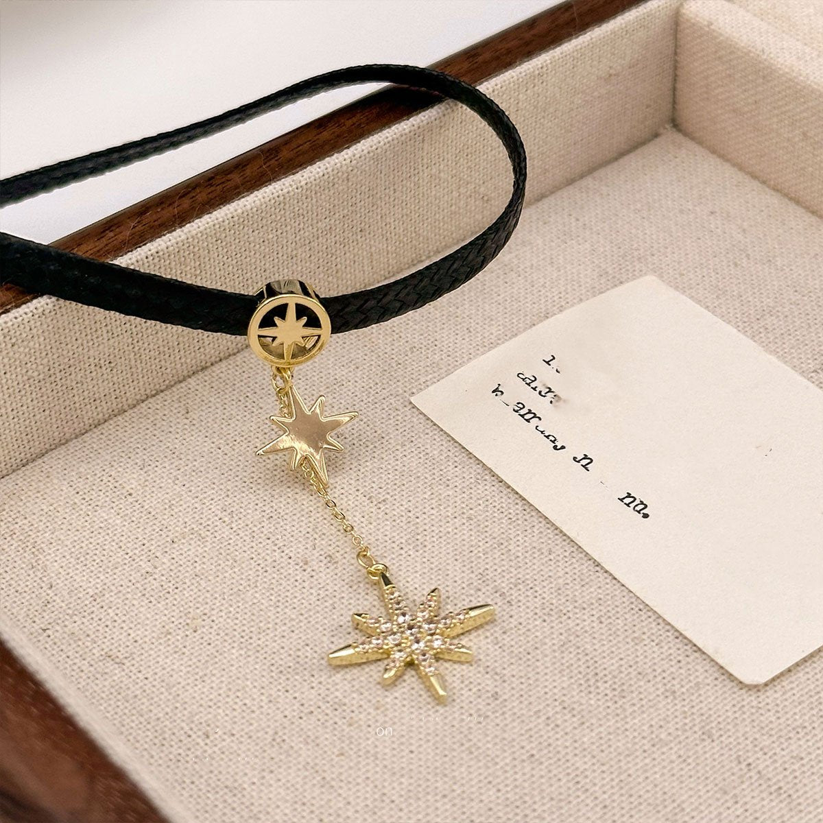 Black leather choker with star pendant