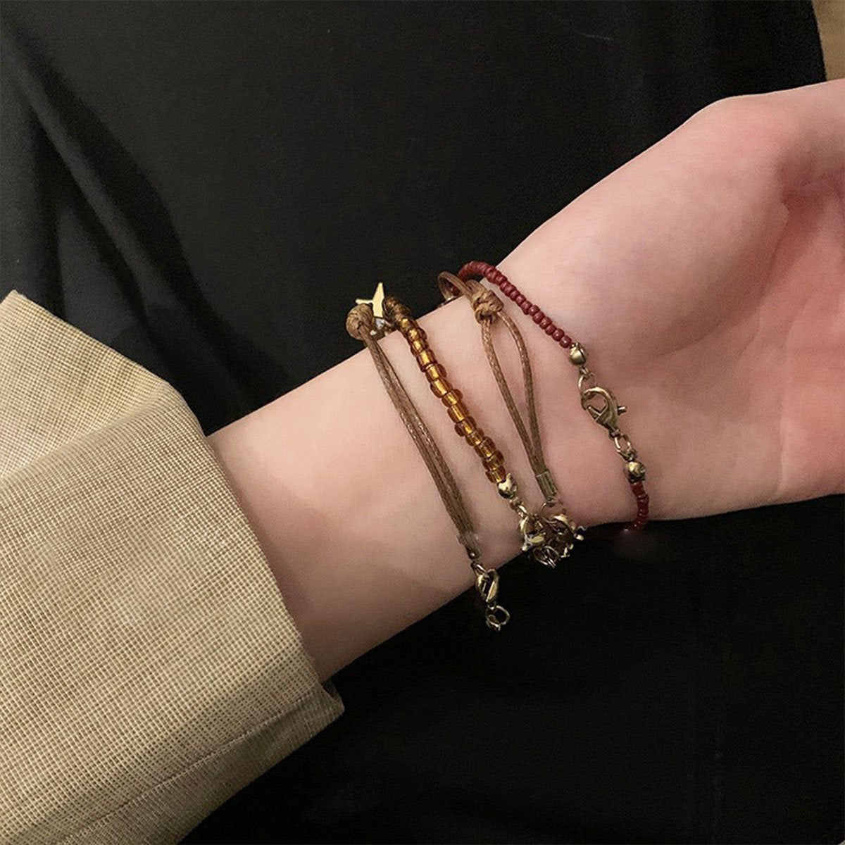 Elegant glass and crystal boho bracelet with earthy tones and charms