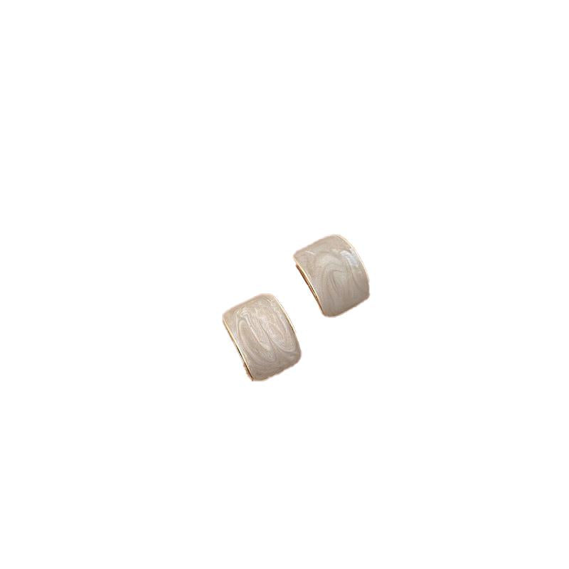 Elegant everyday earrings with ivory inlay and gold-tone frame