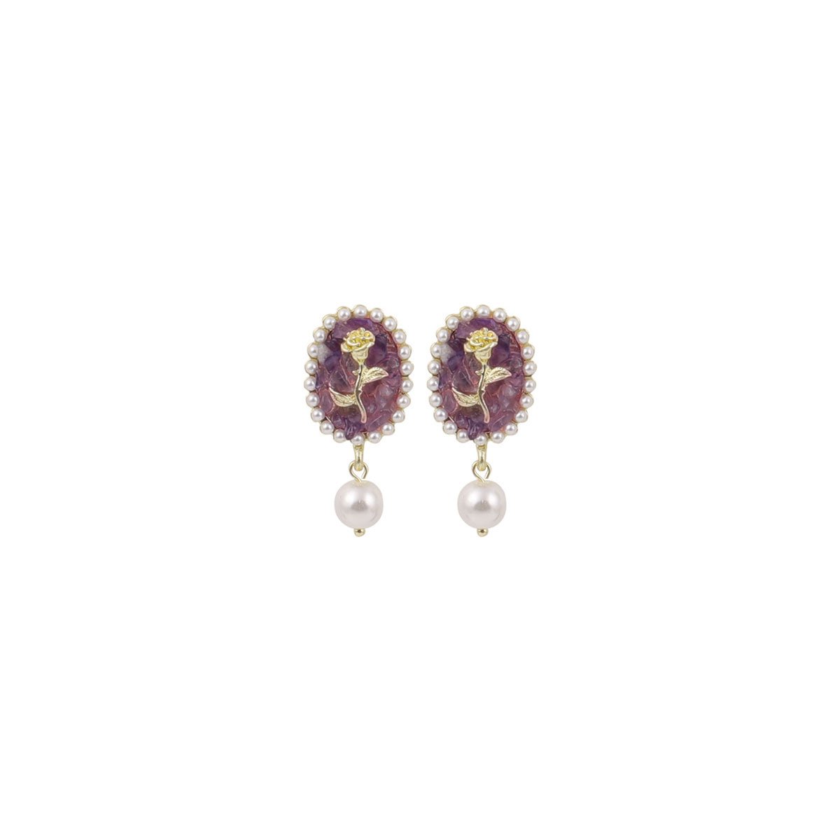 Vintage-inspired floral earrings with pearl drops.