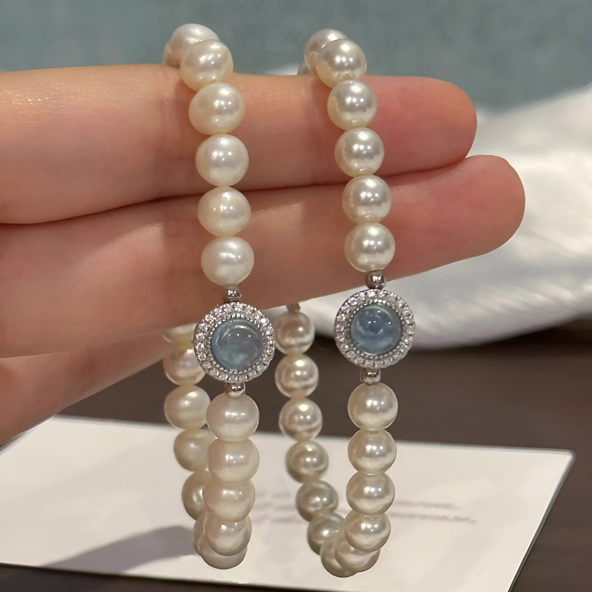 Pearl Bracelet with Blue Gemstone Accent