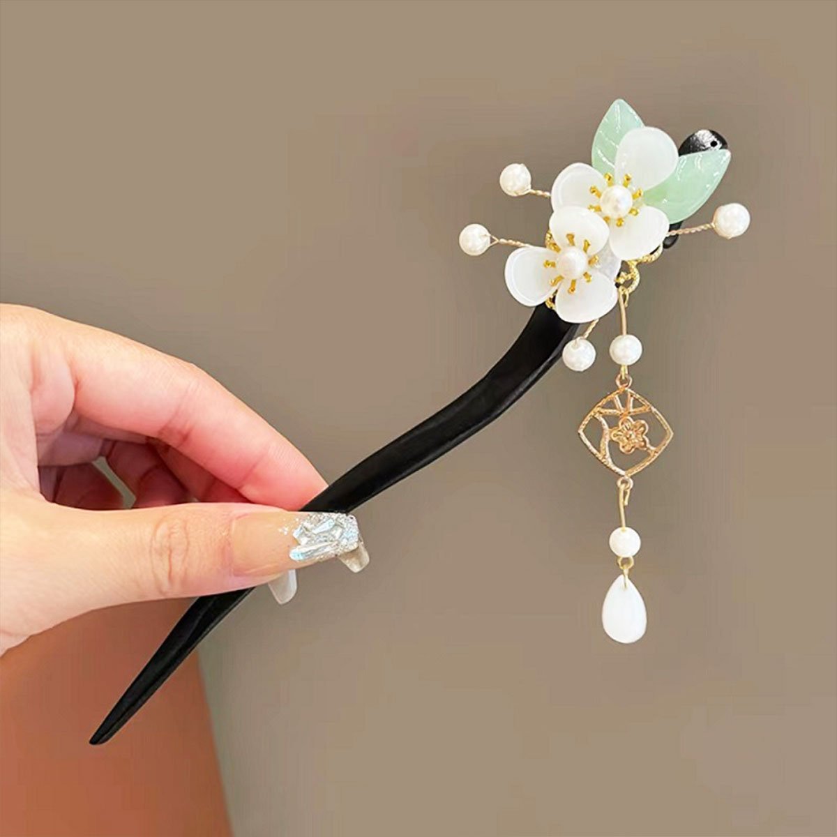Elegant black hair ornament with floral and bead accents