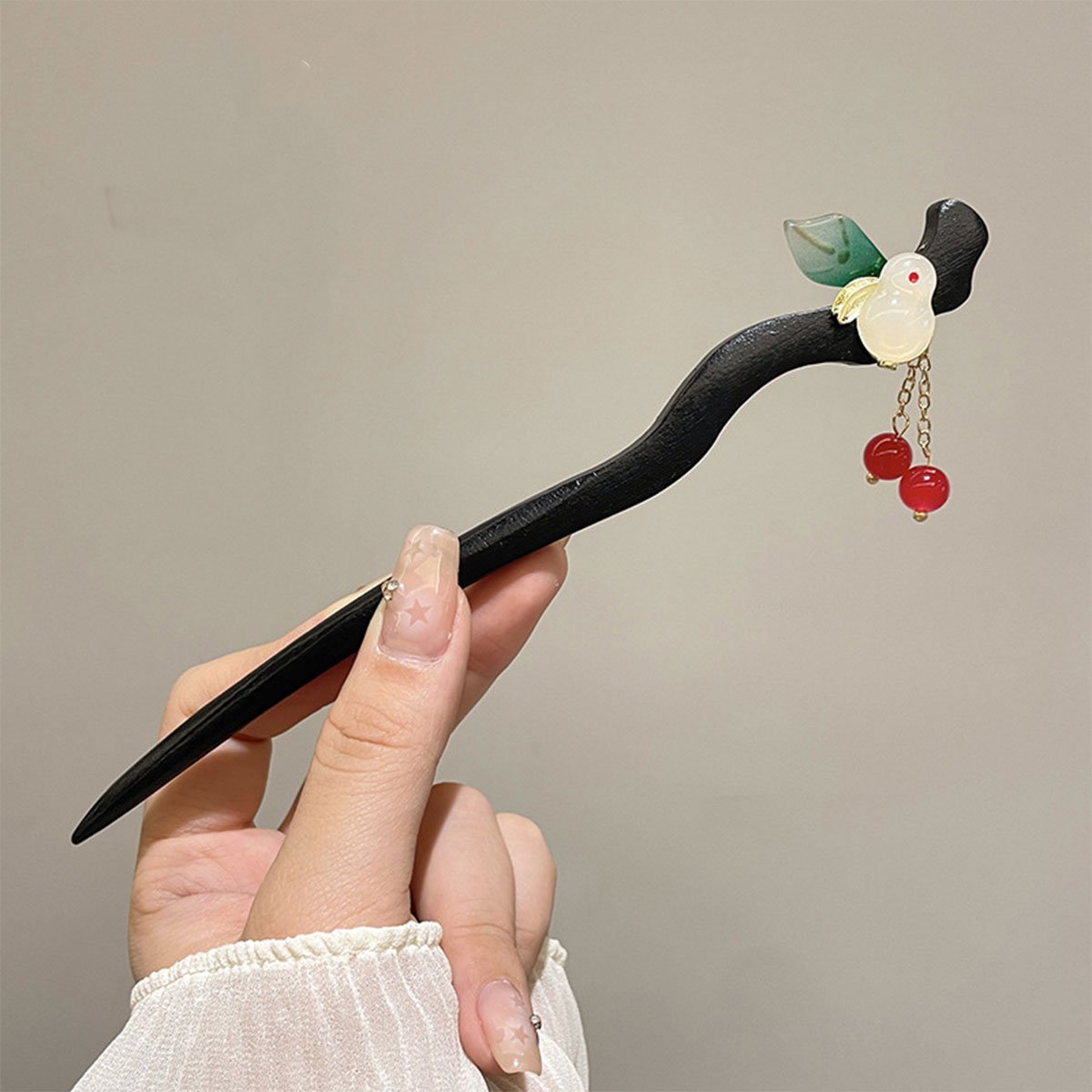 Elegant black hair clip with floral and bead accents