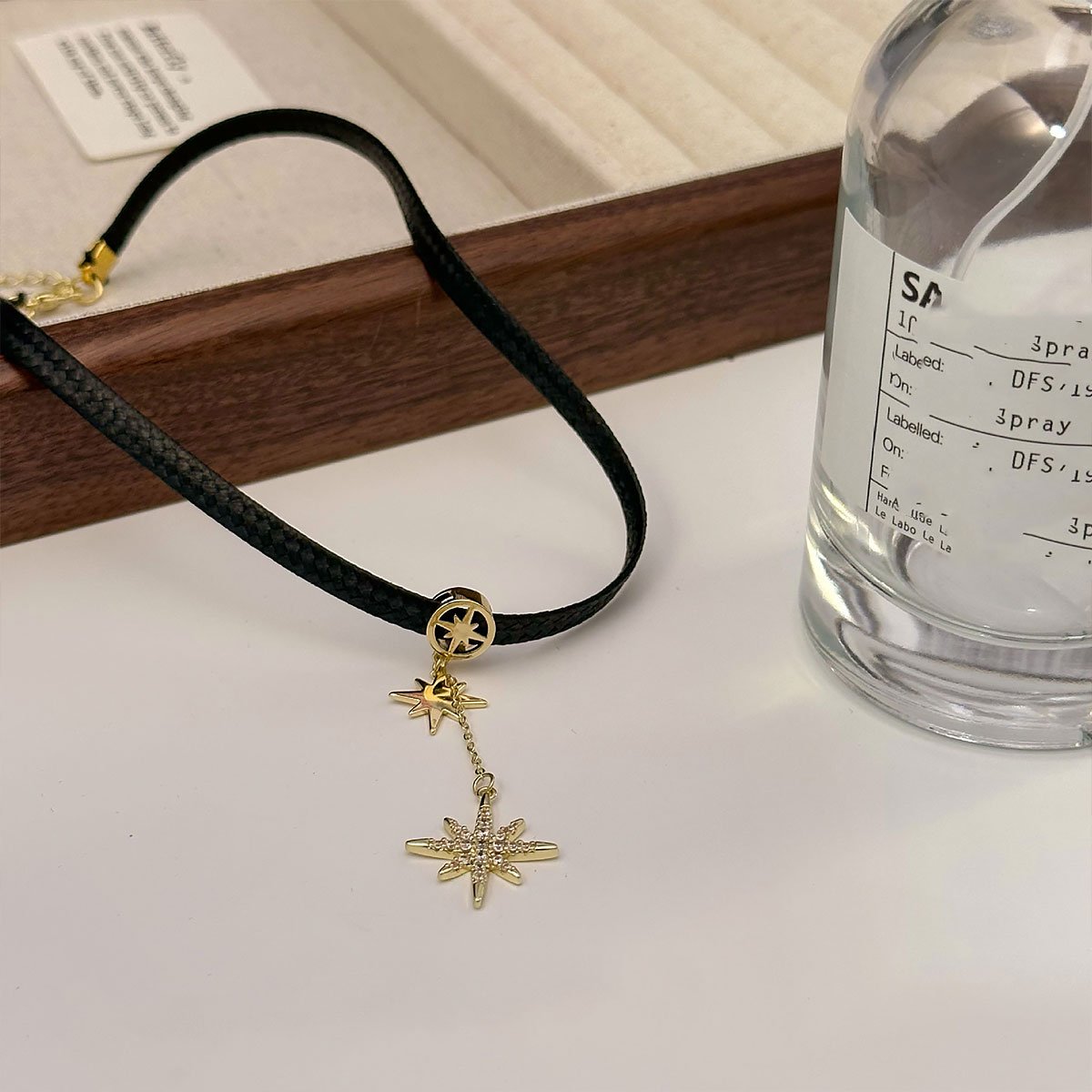 Black leather choker with star pendant