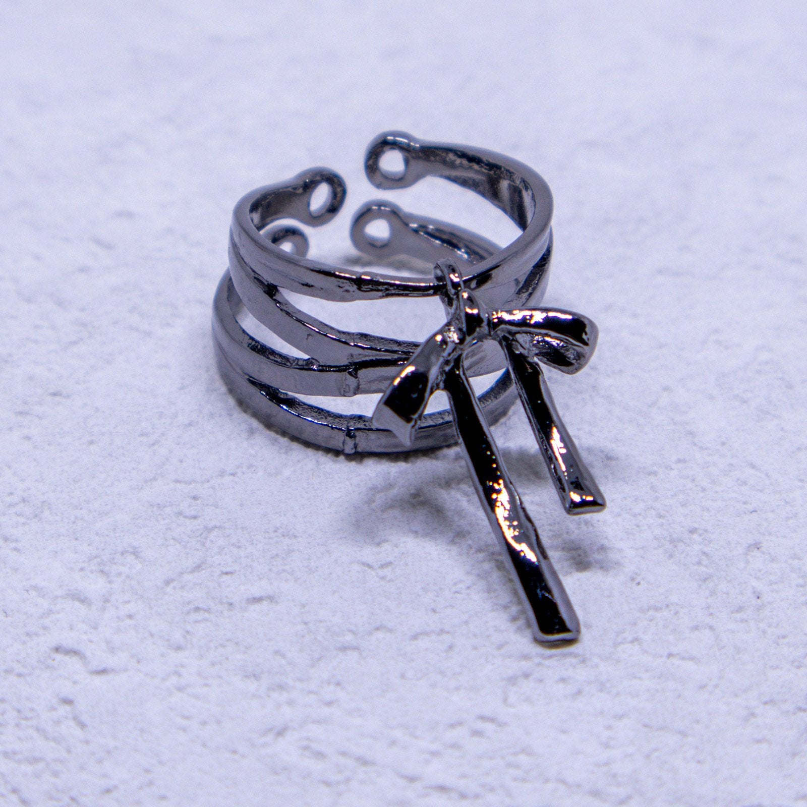Stylish adjustable ring in silver with multiple bands and dangling charm
