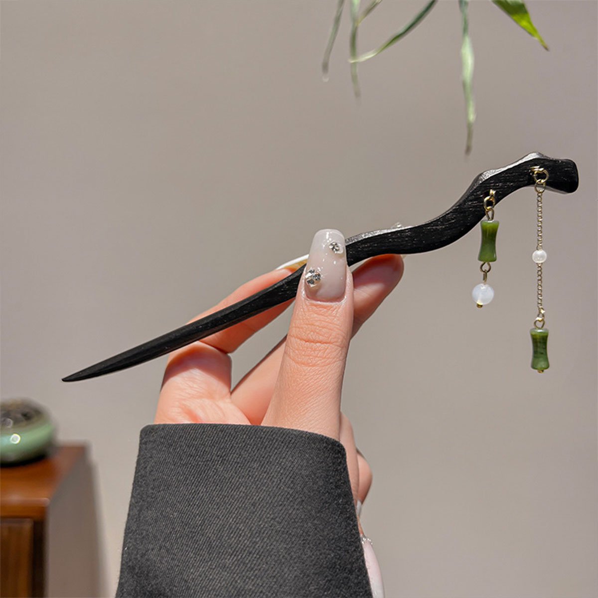 Elegant black hair stick with green bead charm