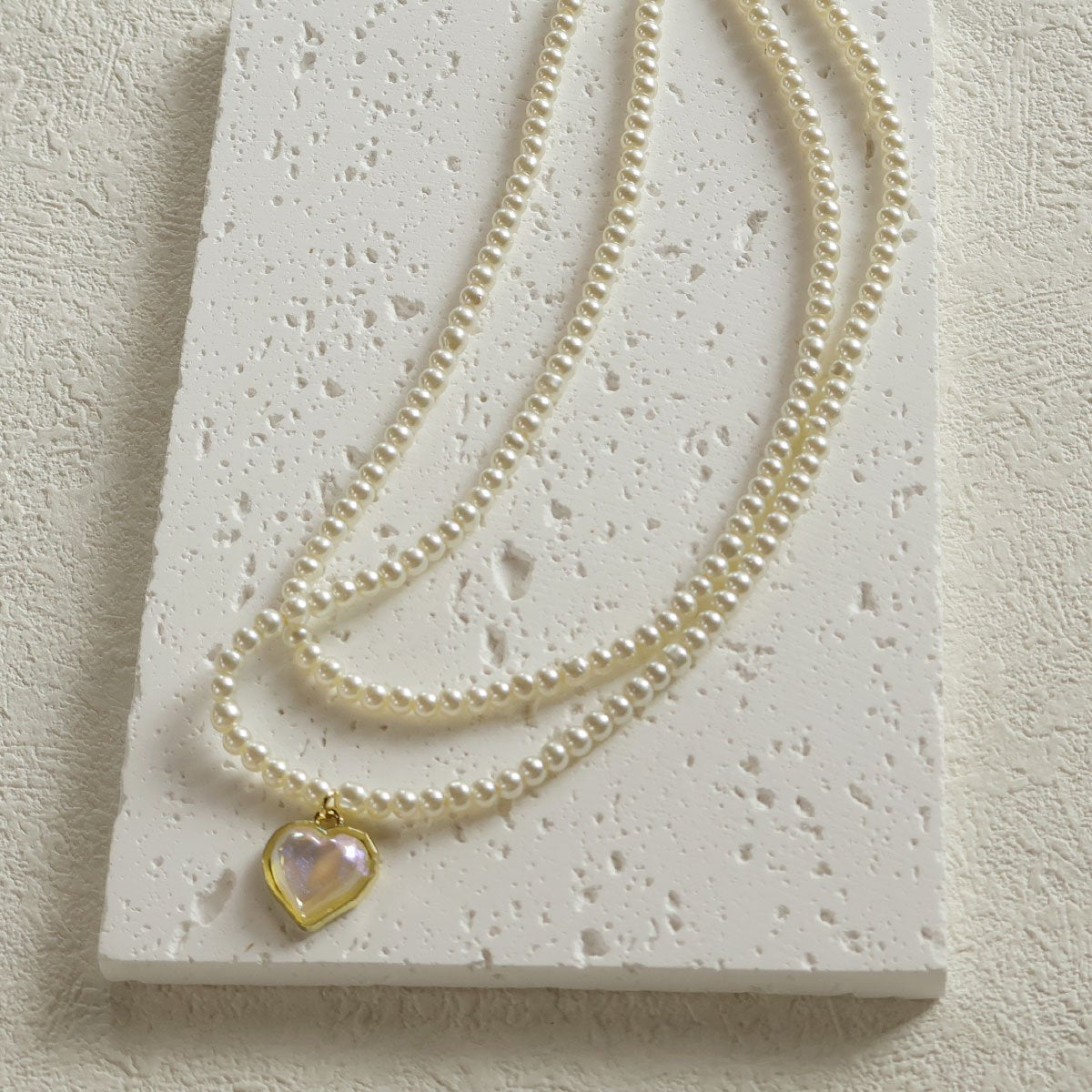 Elegant Dual-Strand Pearl Necklace with Heart Pendant"